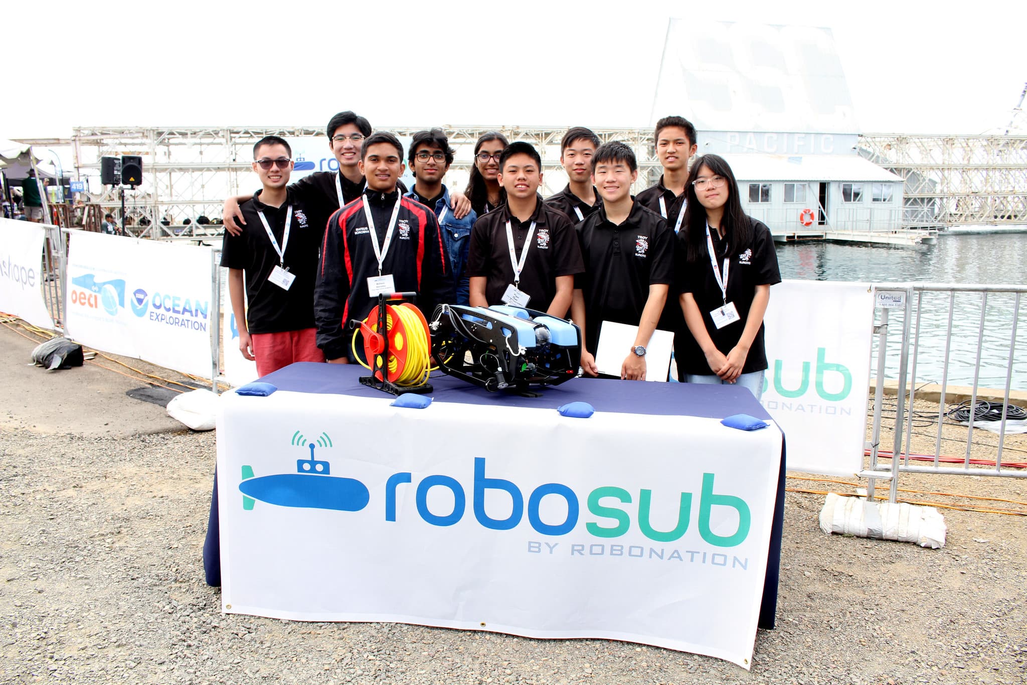 Team photo at RoboSub table with AUV