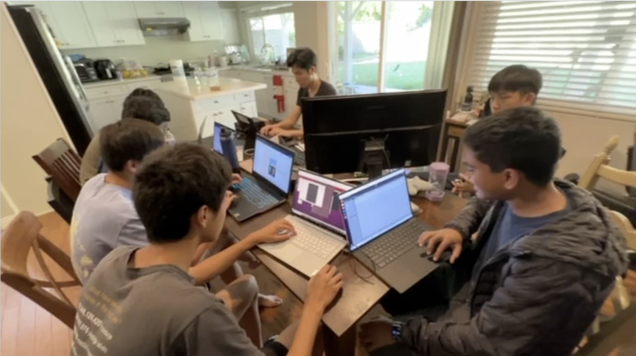 Software team working on laptops