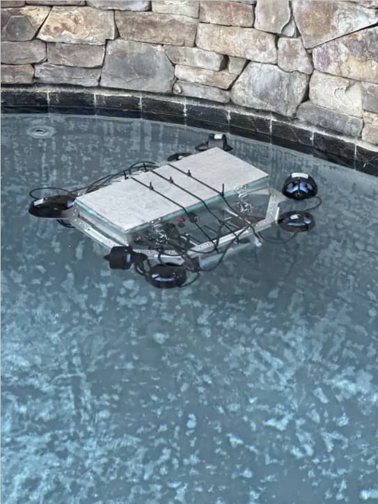 AUV floating in a pool during testing